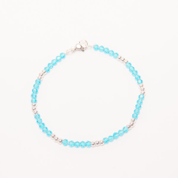 PULSERA ACERO BLANCO CON CRISTAL CELESTE Y 3 BOLITAS